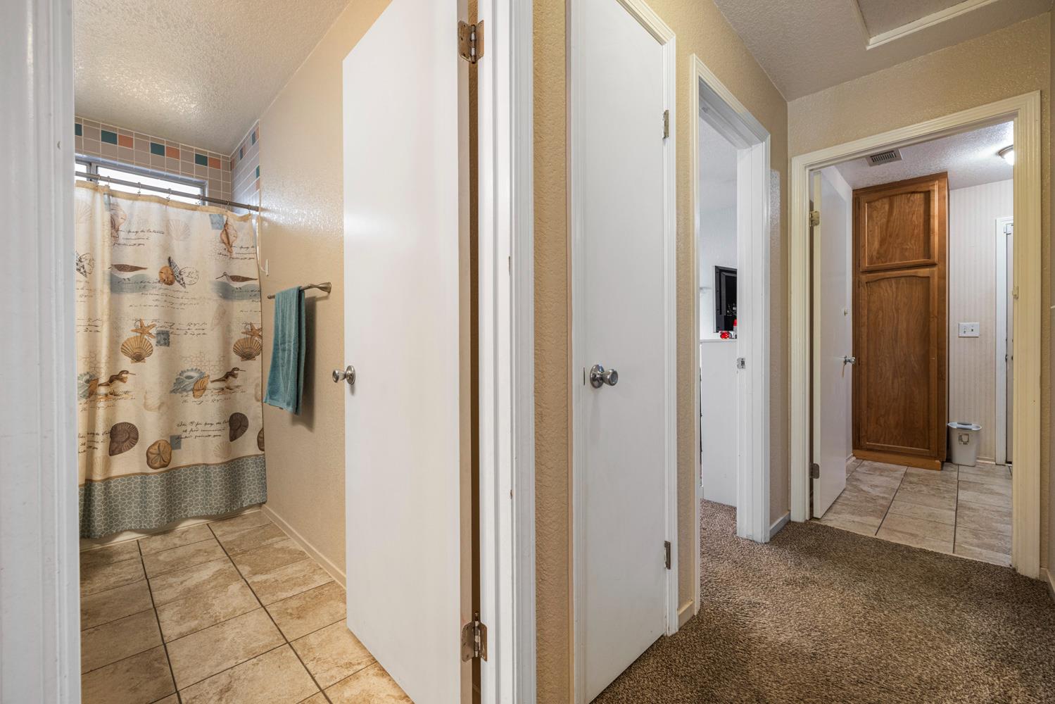 1121 Raymond Drive Modesto, CA 95351 - Photo 29 of 44 a view of a bathroom with a shower