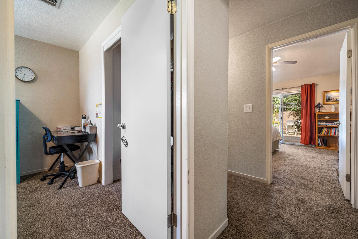 1121 Raymond Drive Modesto, CA 95351 - Photo 30 of 44 a view of a hallway with a livingroom and a chair
