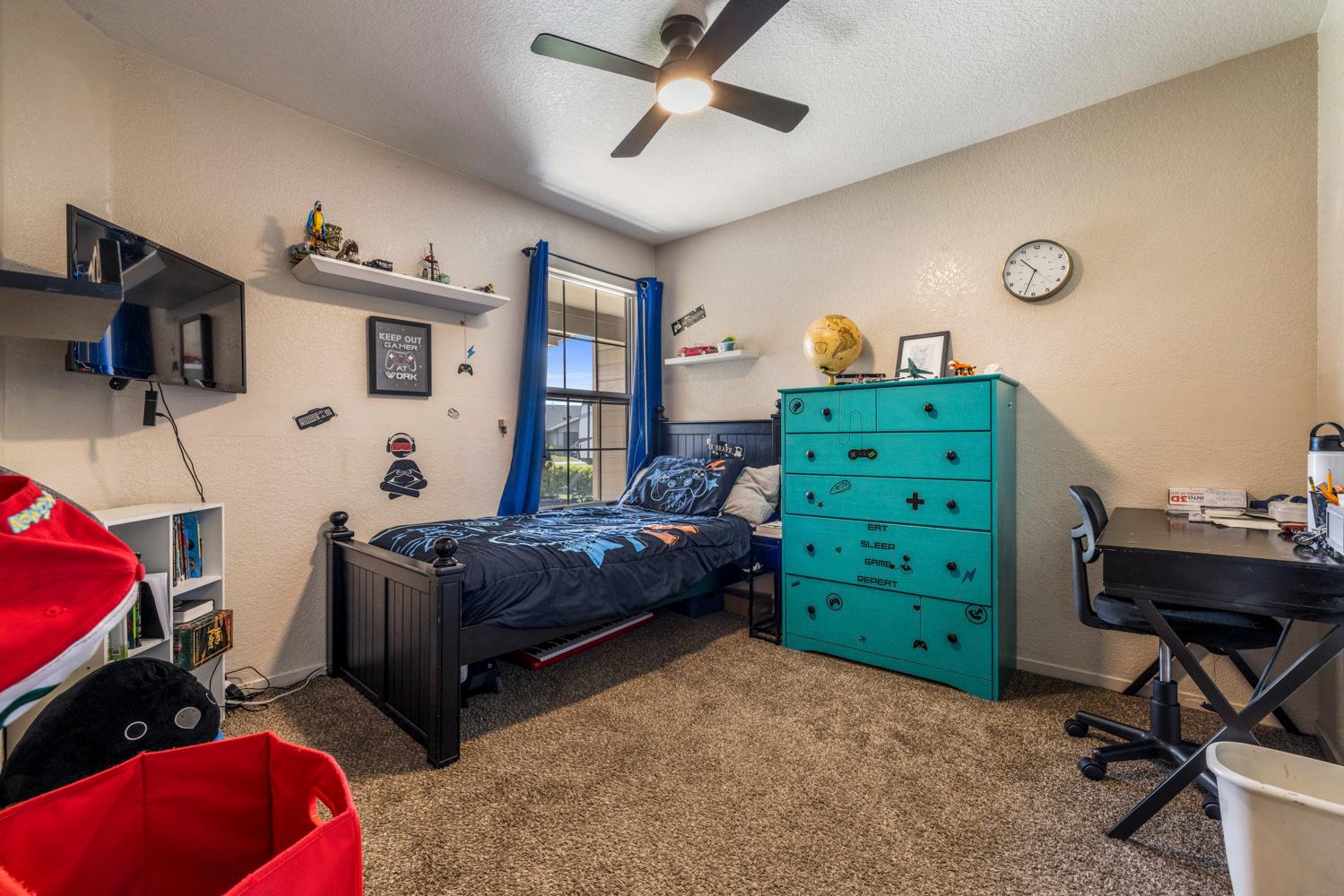 1121 Raymond Drive Modesto, CA 95351 - Photo 31 of 44 a bedroom with a bed and a tv