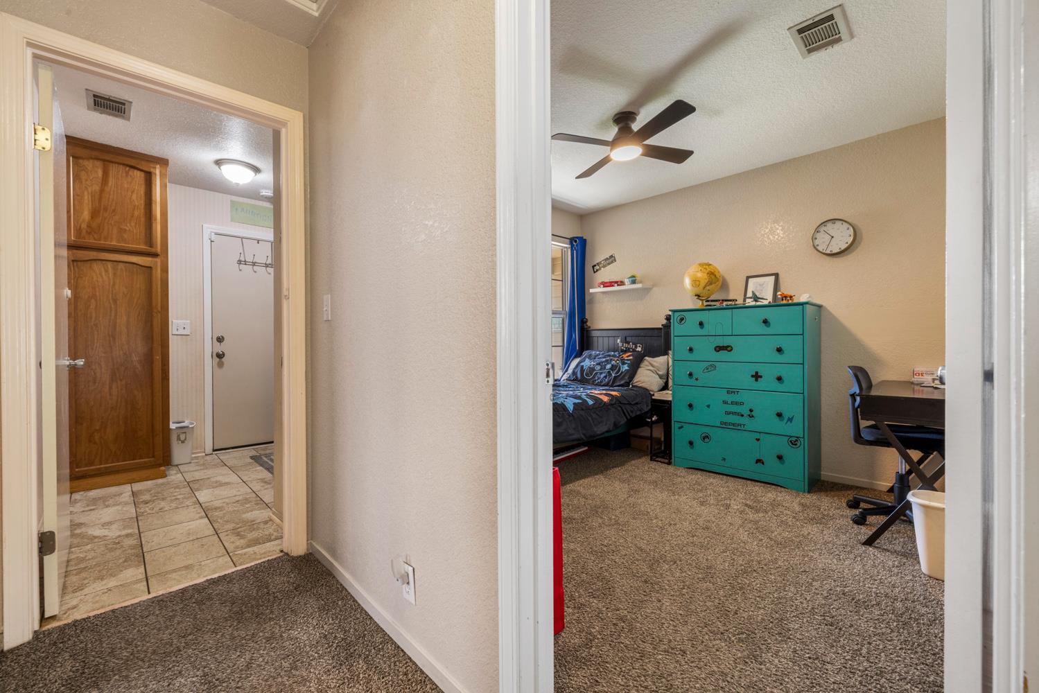 1121 Raymond Drive Modesto, CA 95351 - Photo 32 of 44 a view of room with furniture and closet