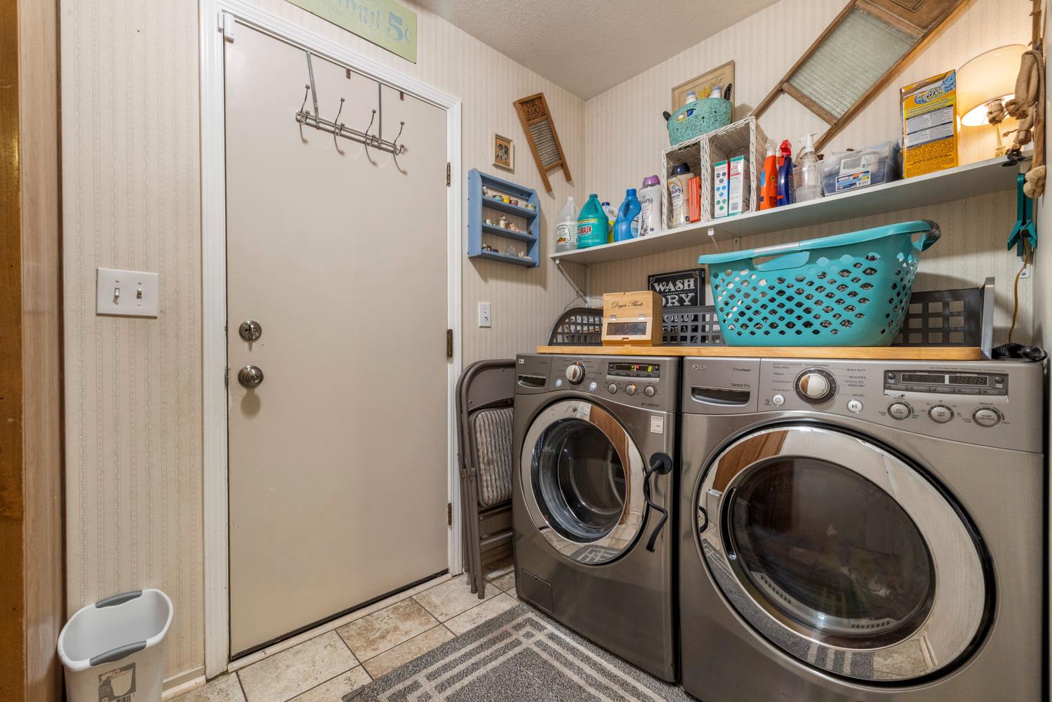 1121 Raymond Drive Modesto, CA 95351 - Photo 35 of 44 a utility room with dryer and washer