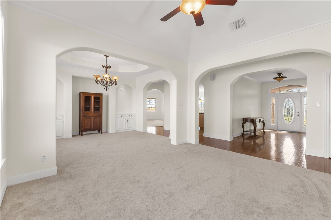 2120 Hohenwalde School Road Brenham, TX 77833 - Photo 8 of 30 a view of a livingroom with a furniture chandelier fan and fire place