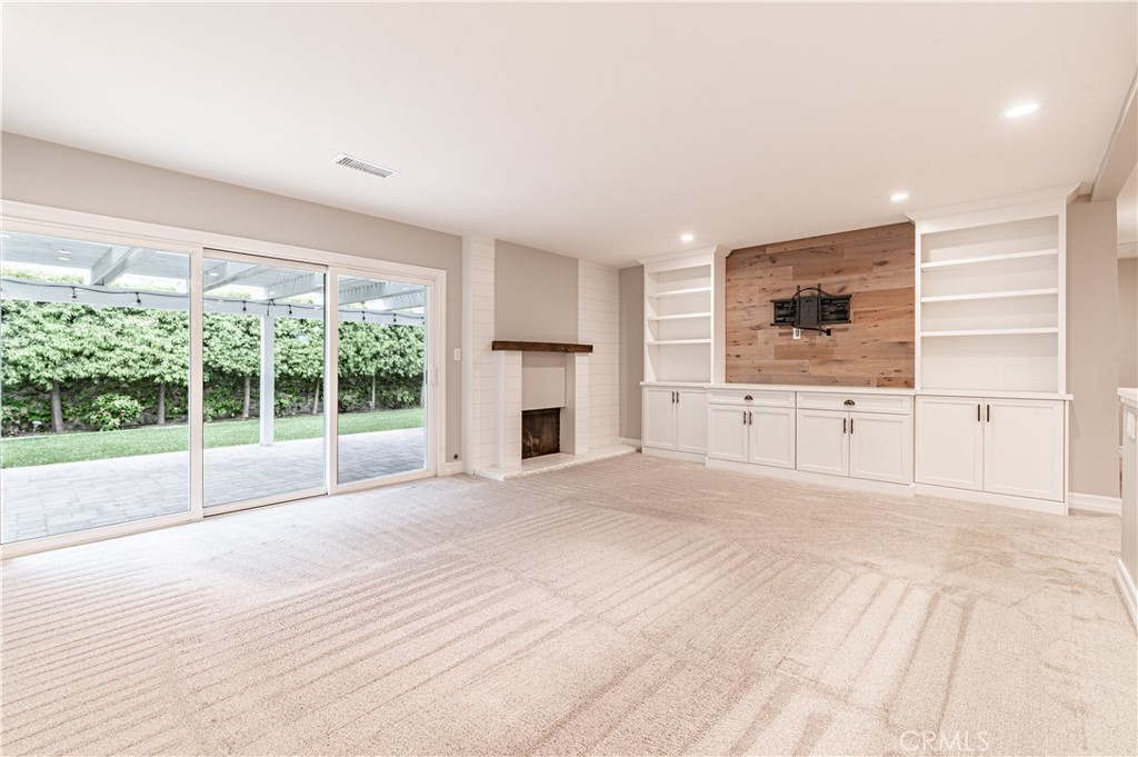 4580 Hazelnut Avenue Seal Beach, CA 90740 - Photo 17 of 34 a view of an empty room with a window and a kitchen