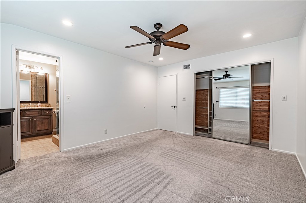 4580 Hazelnut Avenue Seal Beach, CA 90740 - Photo 22 of 34 a view of a livingroom with a ceiling fan and wooden floor