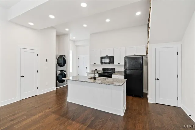 a view of kitchen with microwave and wooden floor