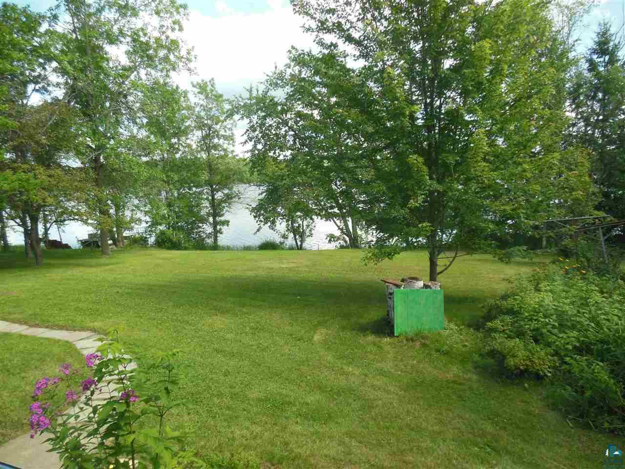 6646 Tam Acres Road Wright, MN 55798 - Photo 3 of 20 Enjoy entertaining or relaxing in this beautiful front yard overlooking the lake!
