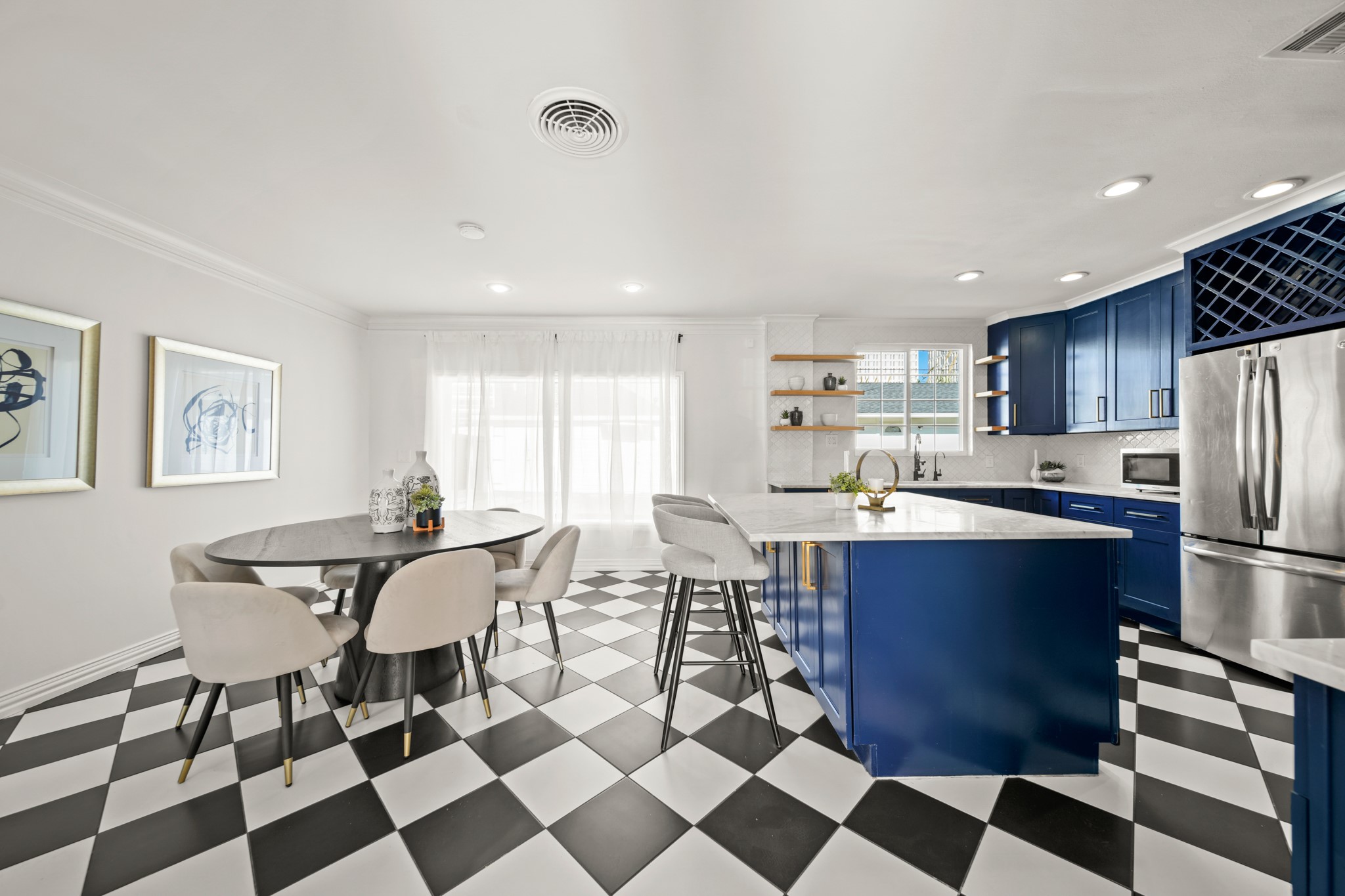 4391 Varsity Lane Houston, TX 77004 - Photo 18 of 45 a kitchen with stainless steel appliances granite countertop a stove a sink a dining table and chairs