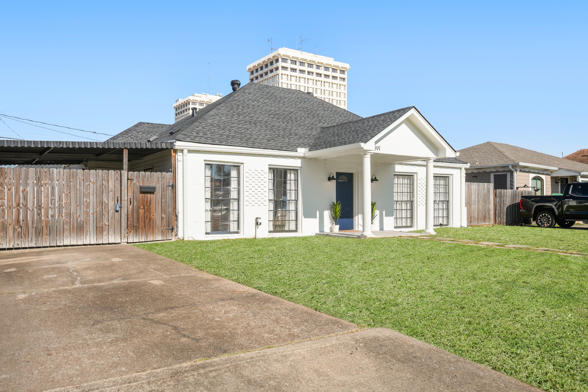 4391 Varsity Lane Houston, TX 77004 - Photo 4 of 45 a front view of a house with a garden and porch
