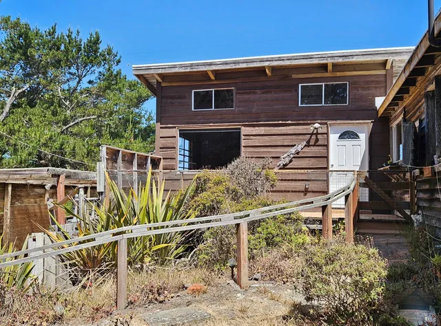 a front view of a house with garage