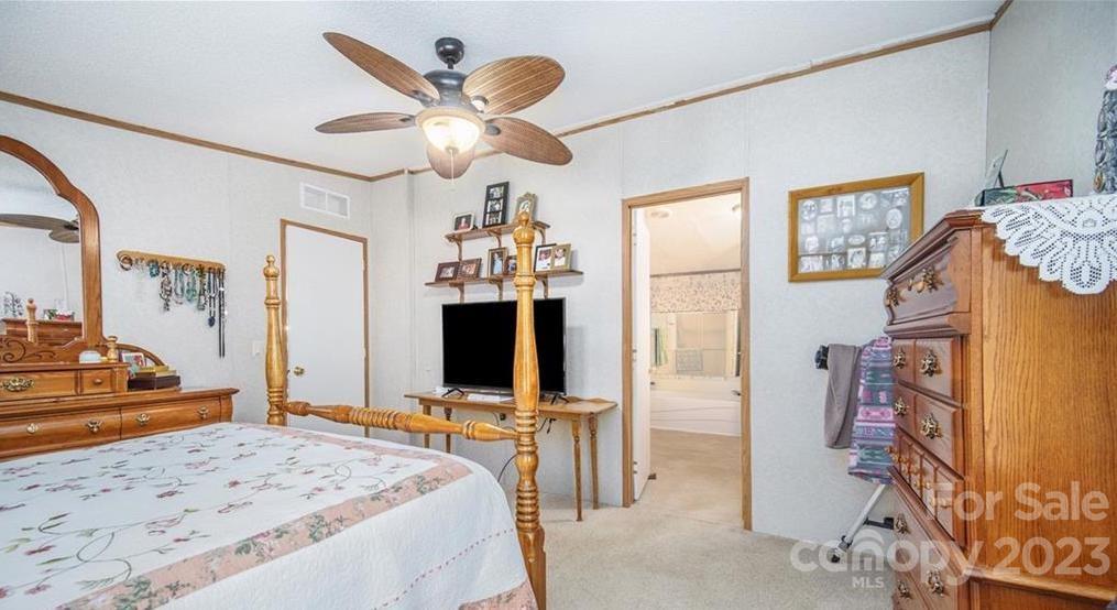 713 Bailey Sawmill Road Ruby, SC 29741 - Photo 7 of 30 a bedroom with a bed and a flat screen tv