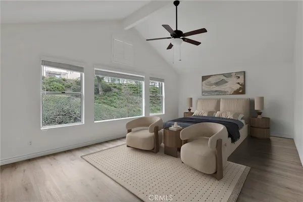 a view of a room with wooden floor fan and a window