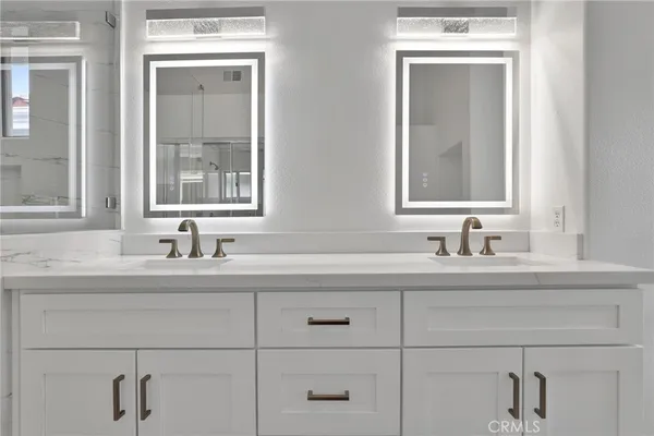 a bath tub sitting in a bathroom next to a window