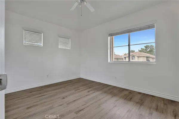 a bathroom with double sink and a mirror