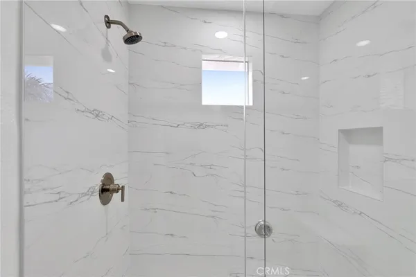 a view of a kitchen with large windows