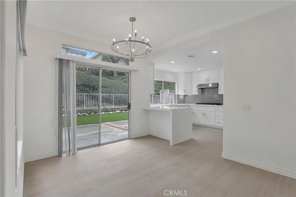 a view of an empty room with windows