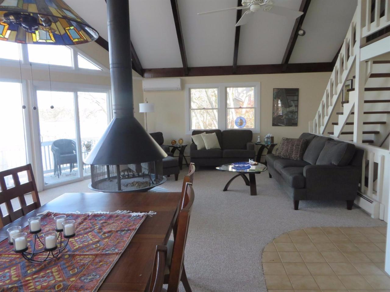 160 Huckins Neck Road Centerville, MA 02601 - Photo 3 of 25 a living room with furniture and wooden floor