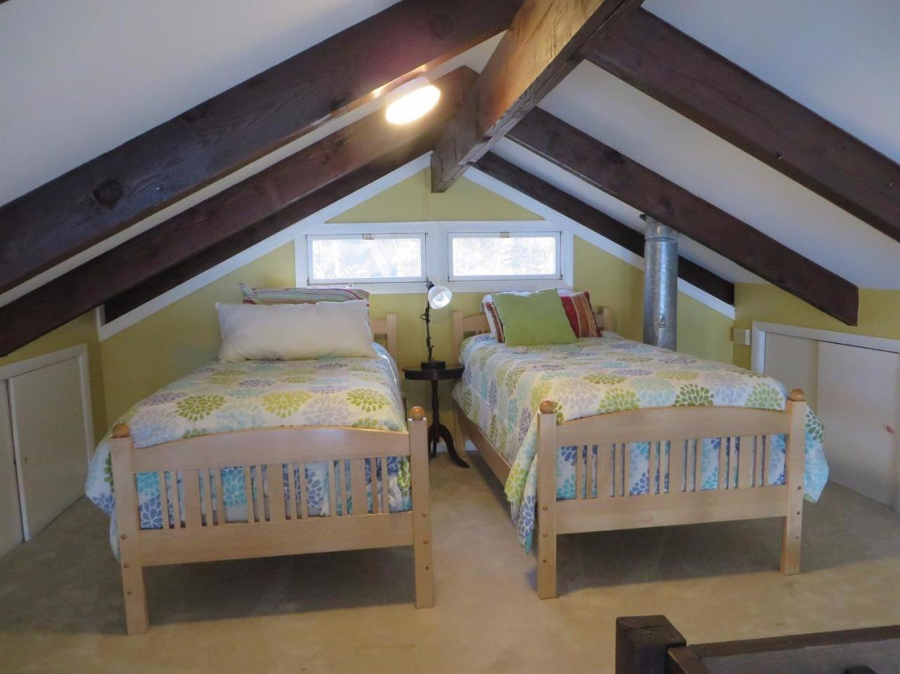 160 Huckins Neck Road Centerville, MA 02601 - Photo 8 of 25 a bedroom with two beds and a window