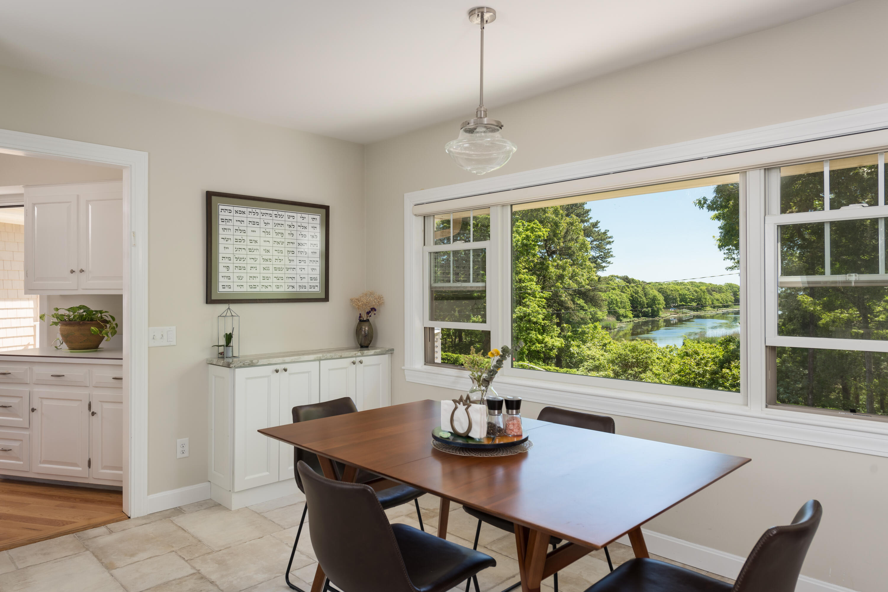 180 Riverview Lane Centerville, MA 02632 - Photo 16 of 55 a view of a dining room with furniture window and outside view