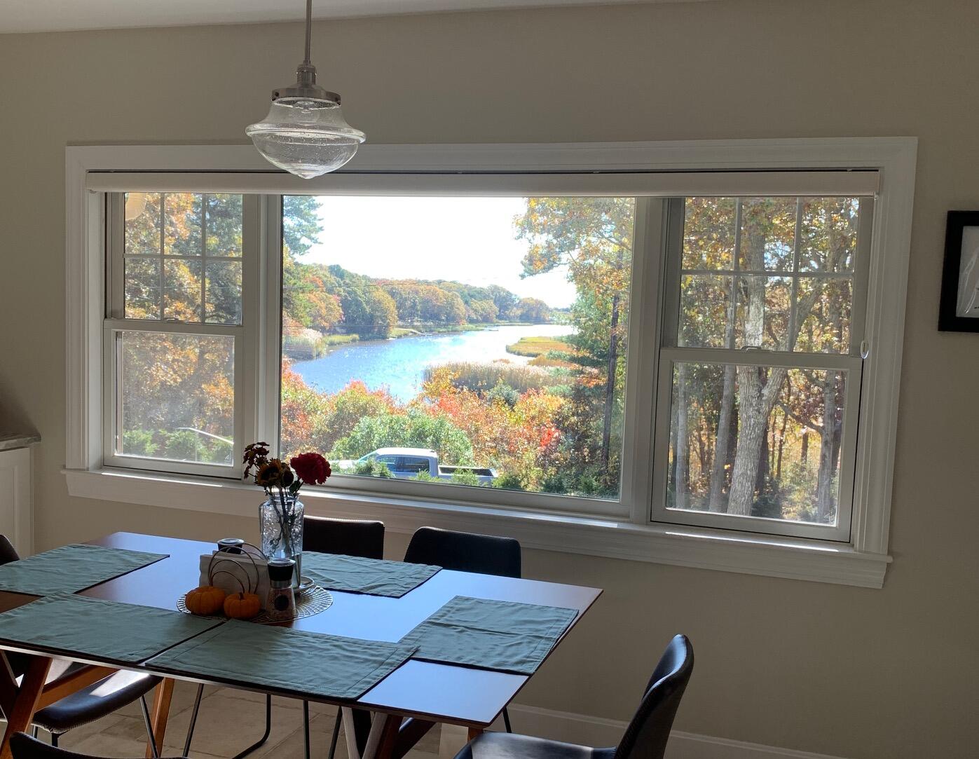 180 Riverview Lane Centerville, MA 02632 - Photo 17 of 55 a view of a dining room with furniture window and outside view