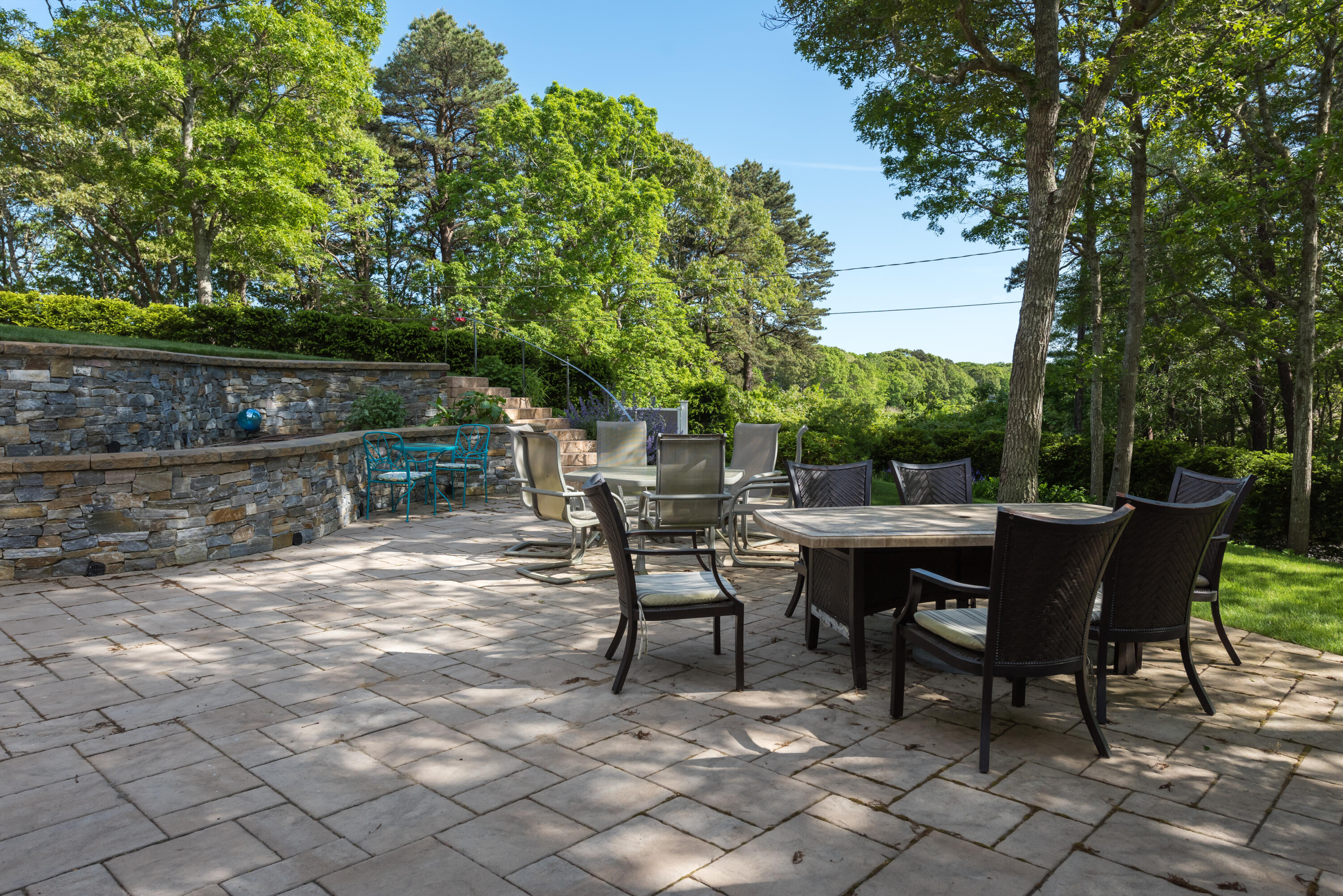 180 Riverview Lane Centerville, MA 02632 - Photo 37 of 55 a view of backyard with table and chairs and large trees