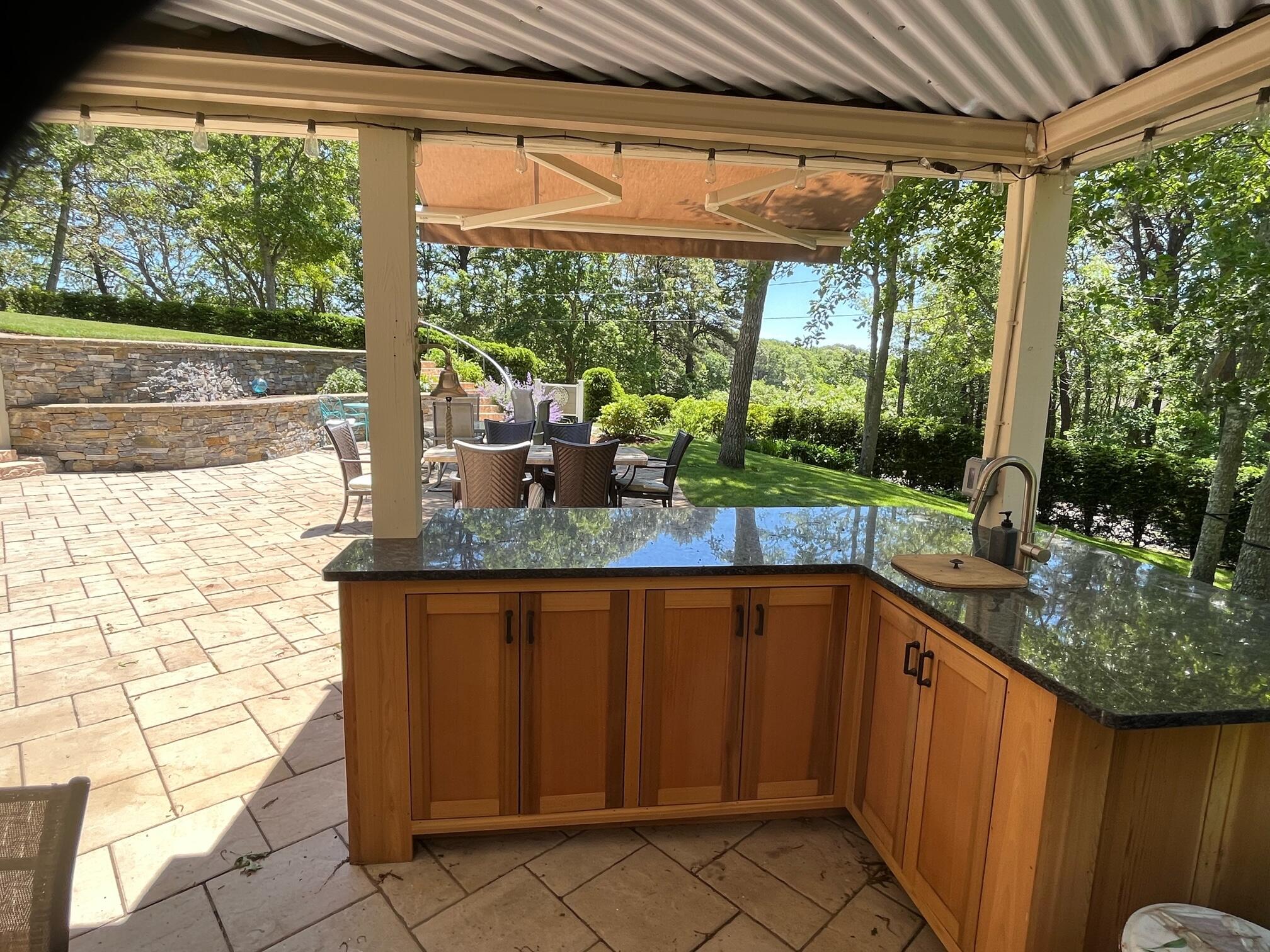 180 Riverview Lane Centerville, MA 02632 - Photo 39 of 55 a kitchen with granite countertop a stove and a sink