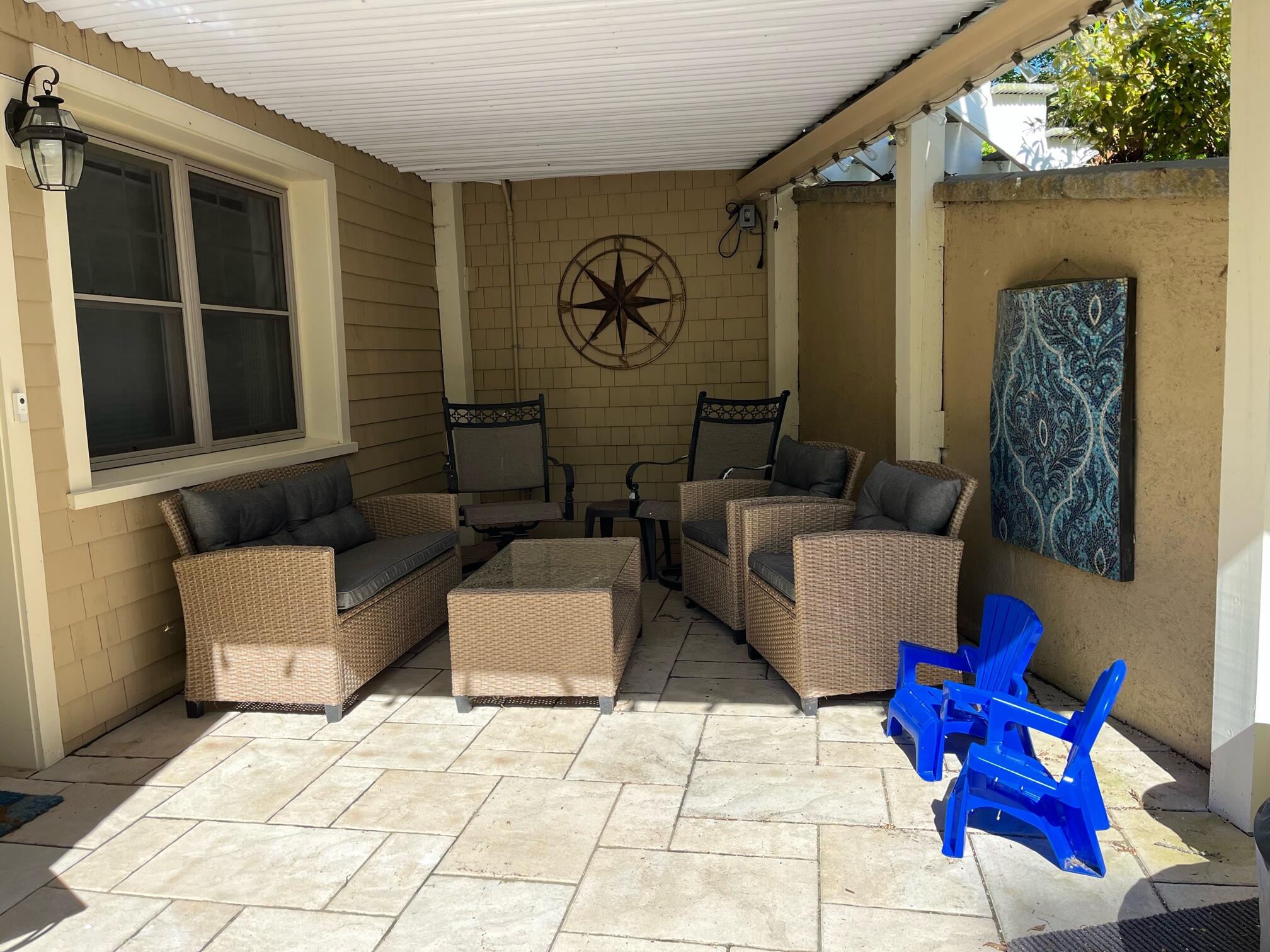 180 Riverview Lane Centerville, MA 02632 - Photo 40 of 55 a building outdoor space with patio furniture and window