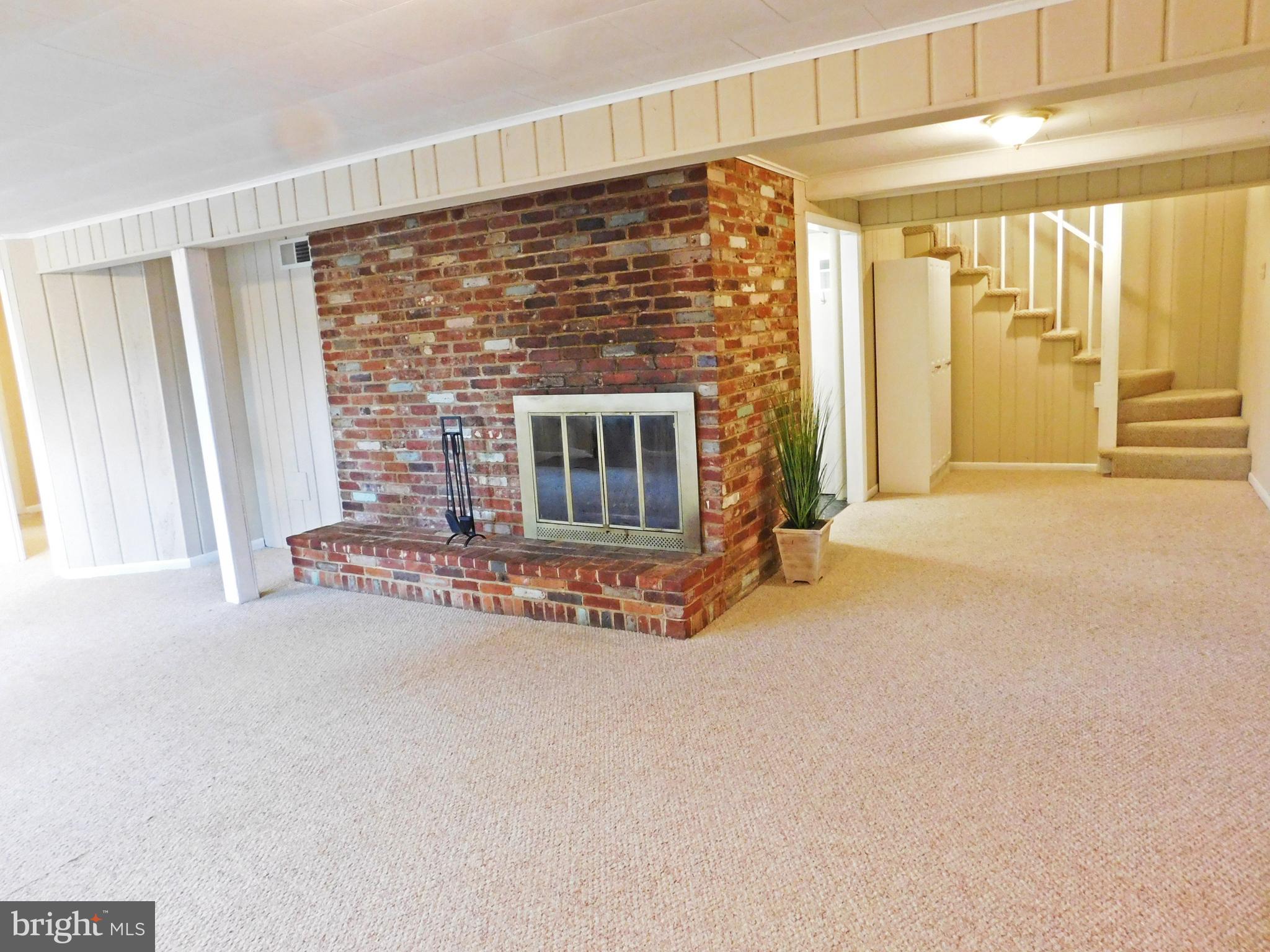 3501 Old Post Road Fairfax, VA 22030 - Photo 14 of 32 Lower Level Family Room - raised hearth brick fplc