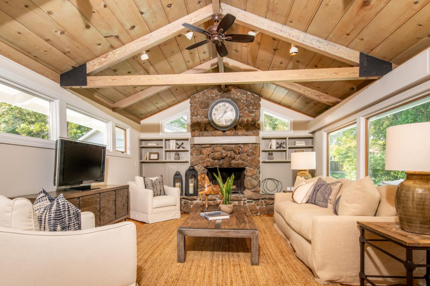 630 Covington Road Los Altos, CA 94024 - Photo 13 of 27 a living room with furniture a fireplace and a flat screen tv
