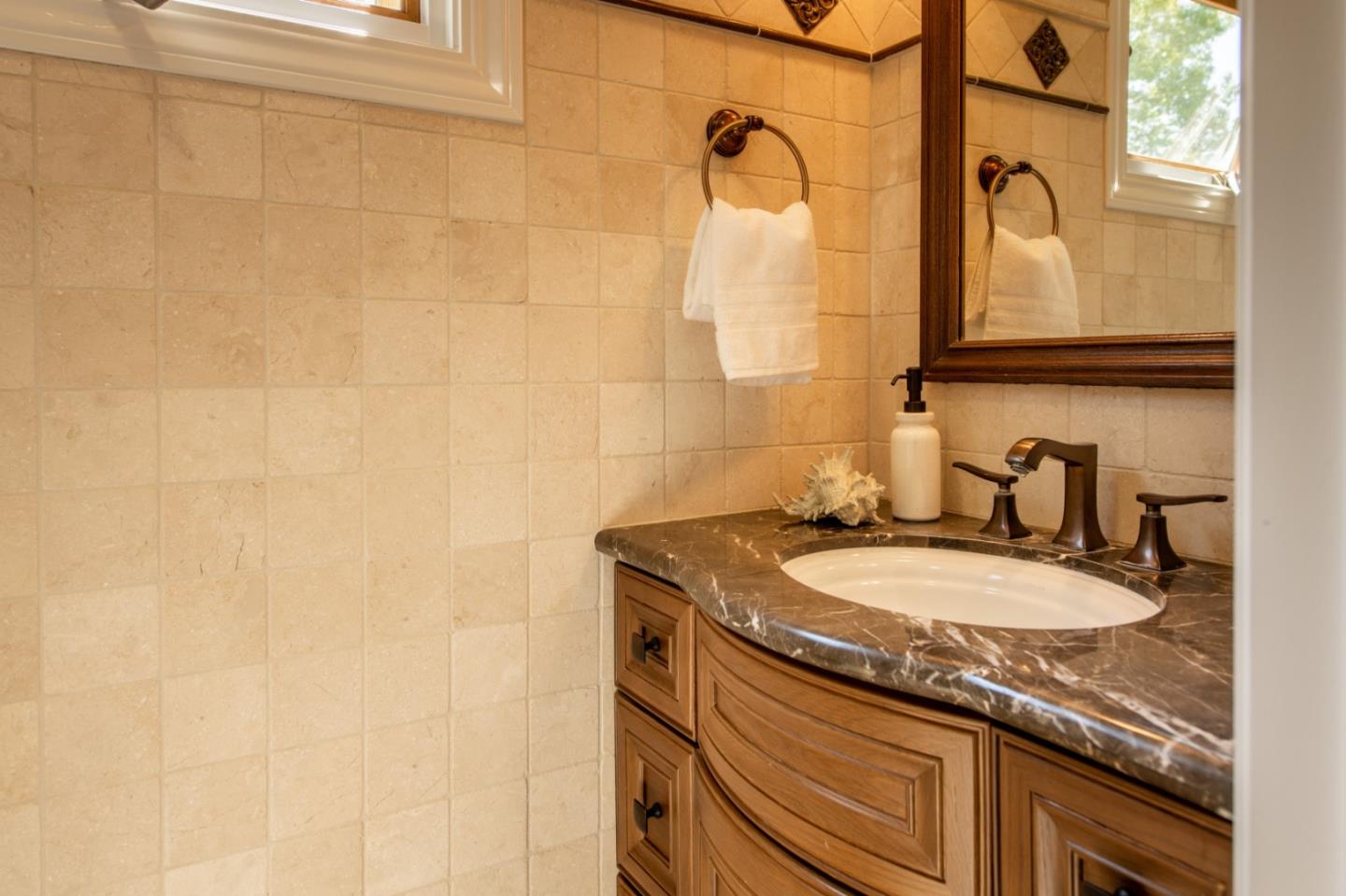 630 Covington Road Los Altos, CA 94024 - Photo 20 of 27 a bathroom with a granite countertop sink and a mirror
