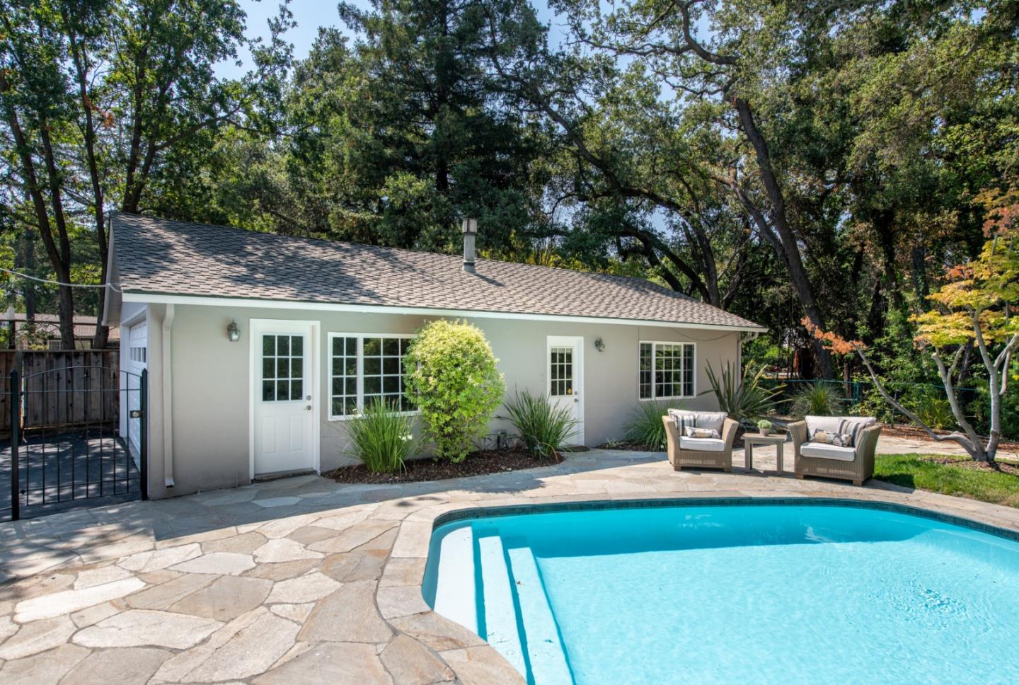 630 Covington Road Los Altos, CA 94024 - Photo 21 of 27 a view of a house with backyard sitting area and garden