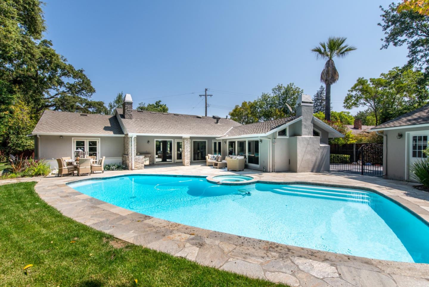 630 Covington Road Los Altos, CA 94024 - Photo 24 of 27 a front view of house with yard and swimming pool