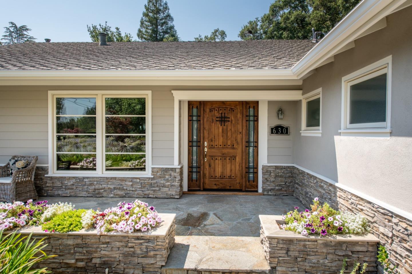 630 Covington Road Los Altos, CA 94024 - Photo 3 of 27 a front view of a house with a garden