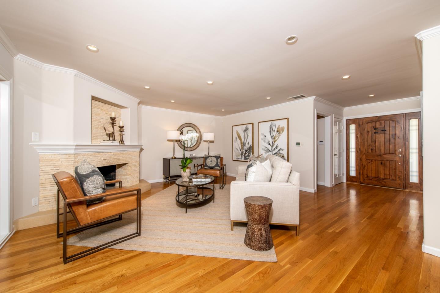 630 Covington Road Los Altos, CA 94024 - Photo 4 of 27 a living room with furniture a fireplace and a table