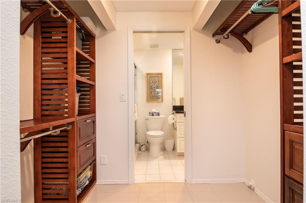 760 Willowbrook Drive, Unit 1202 Naples, FL 34108 - Photo 18 of 28 a view of bathroom with a shower and a toilet
