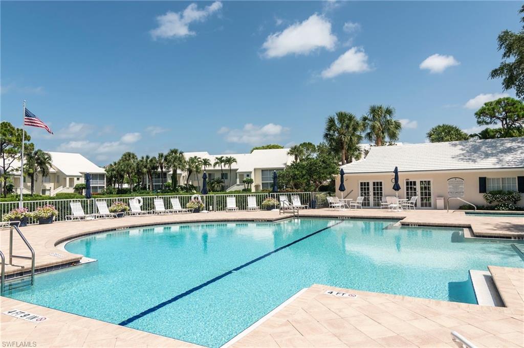 760 Willowbrook Drive, Unit 1202 Naples, FL 34108 - Photo 21 of 28 a view of a house with swimming pool