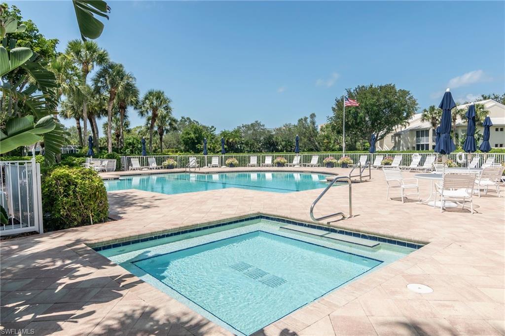 760 Willowbrook Drive, Unit 1202 Naples, FL 34108 - Photo 22 of 28 a view of a swimming pool with an outdoor seating