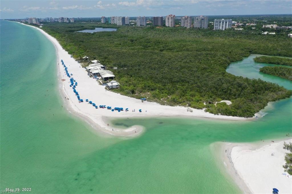 760 Willowbrook Drive, Unit 1202 Naples, FL 34108 - Photo 27 of 28 an aerial view of residential houses with outdoor space and trees