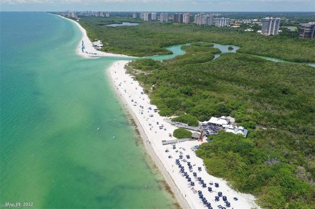 760 Willowbrook Drive, Unit 1202 Naples, FL 34108 - Photo 28 of 28 a view of a golf course with ocean