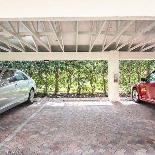 760 Willowbrook Drive, Unit 1202 Naples, FL 34108 - Photo 3 of 28 a view of a backyard of a house