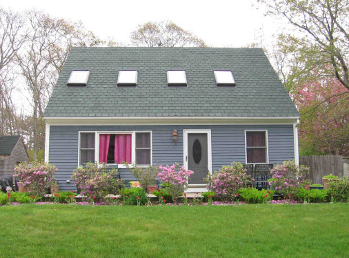 41 Springhill Road Vineyard Haven, MA 02568 - Photo 1 of 1 a front view of house with garden and trees