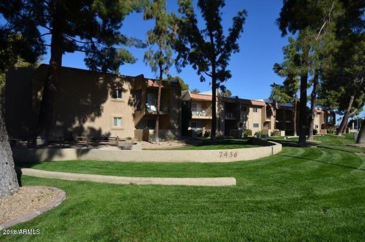 7436 East Chaparral Road, Unit 264B Scottsdale, AZ 85250 - Photo 1 of 27 a view of a house with a big yard and palm trees