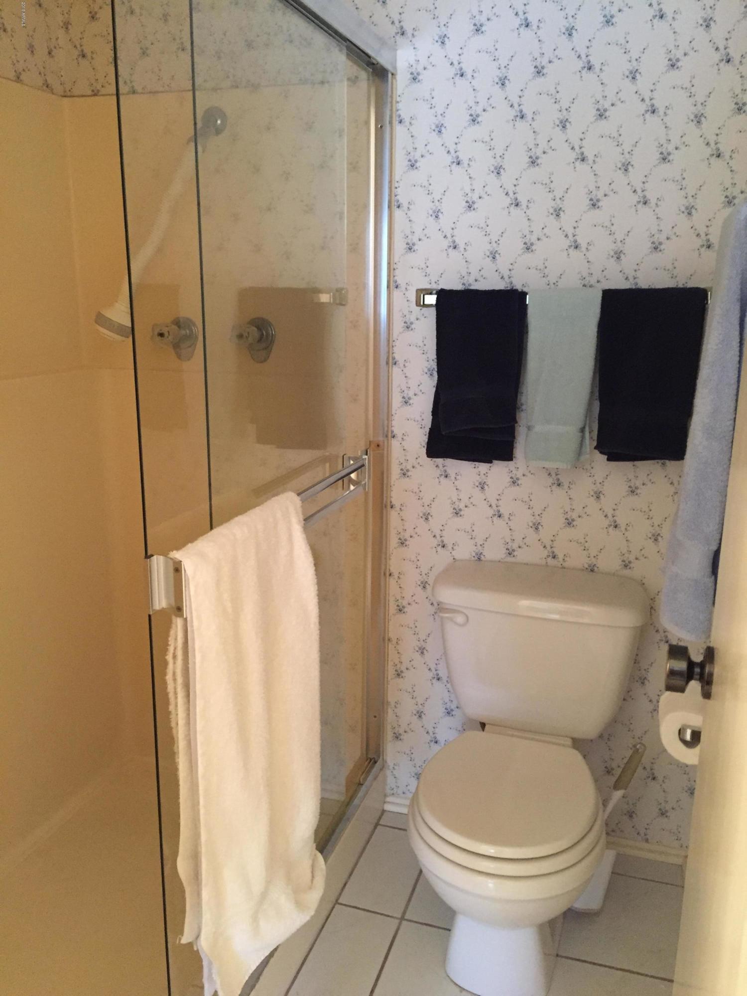 7436 East Chaparral Road, Unit 264B Scottsdale, AZ 85250 - Photo 17 of 27 a bathroom with a toilet and a shower
