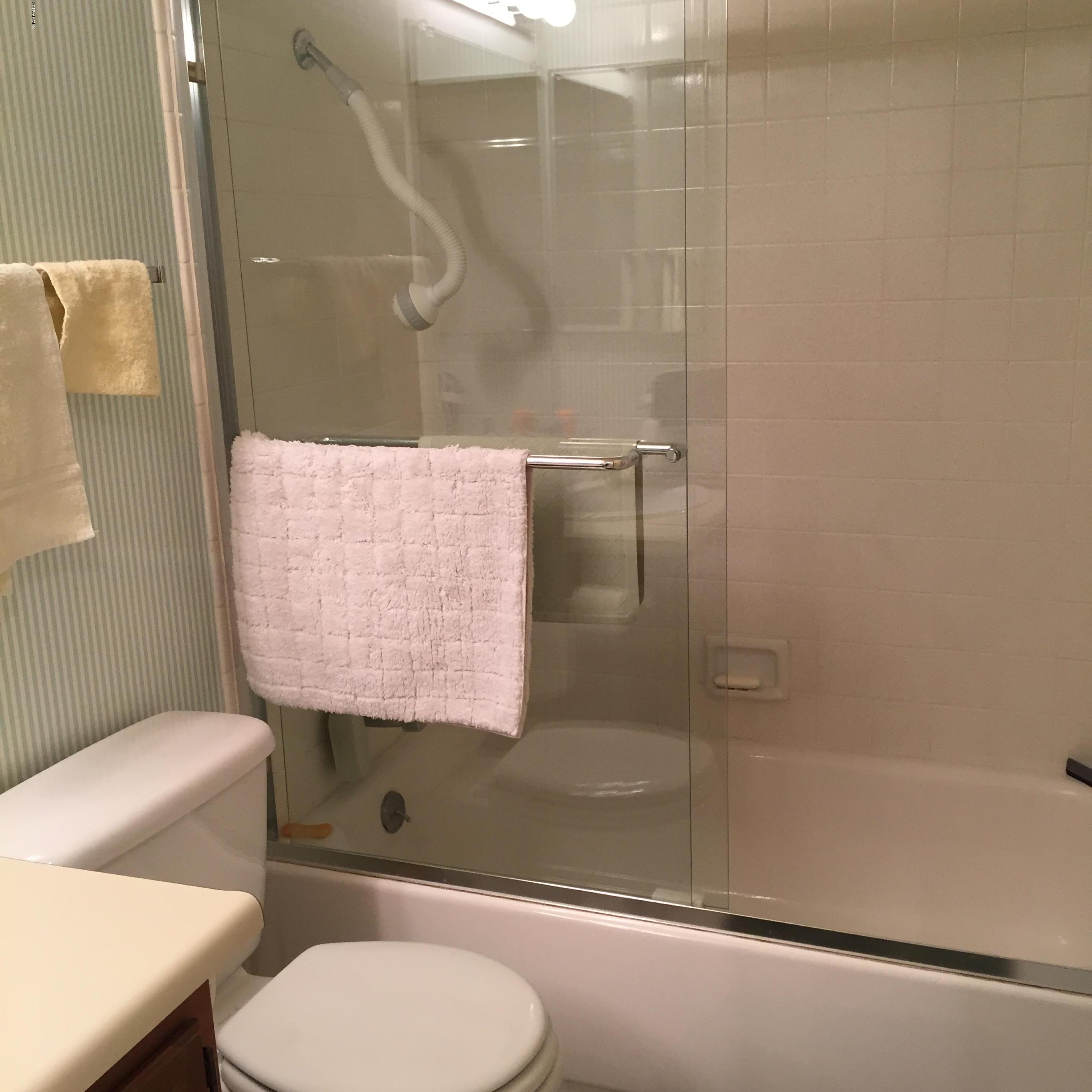 7436 East Chaparral Road, Unit 264B Scottsdale, AZ 85250 - Photo 20 of 27 a bathroom with a toilet and a shower