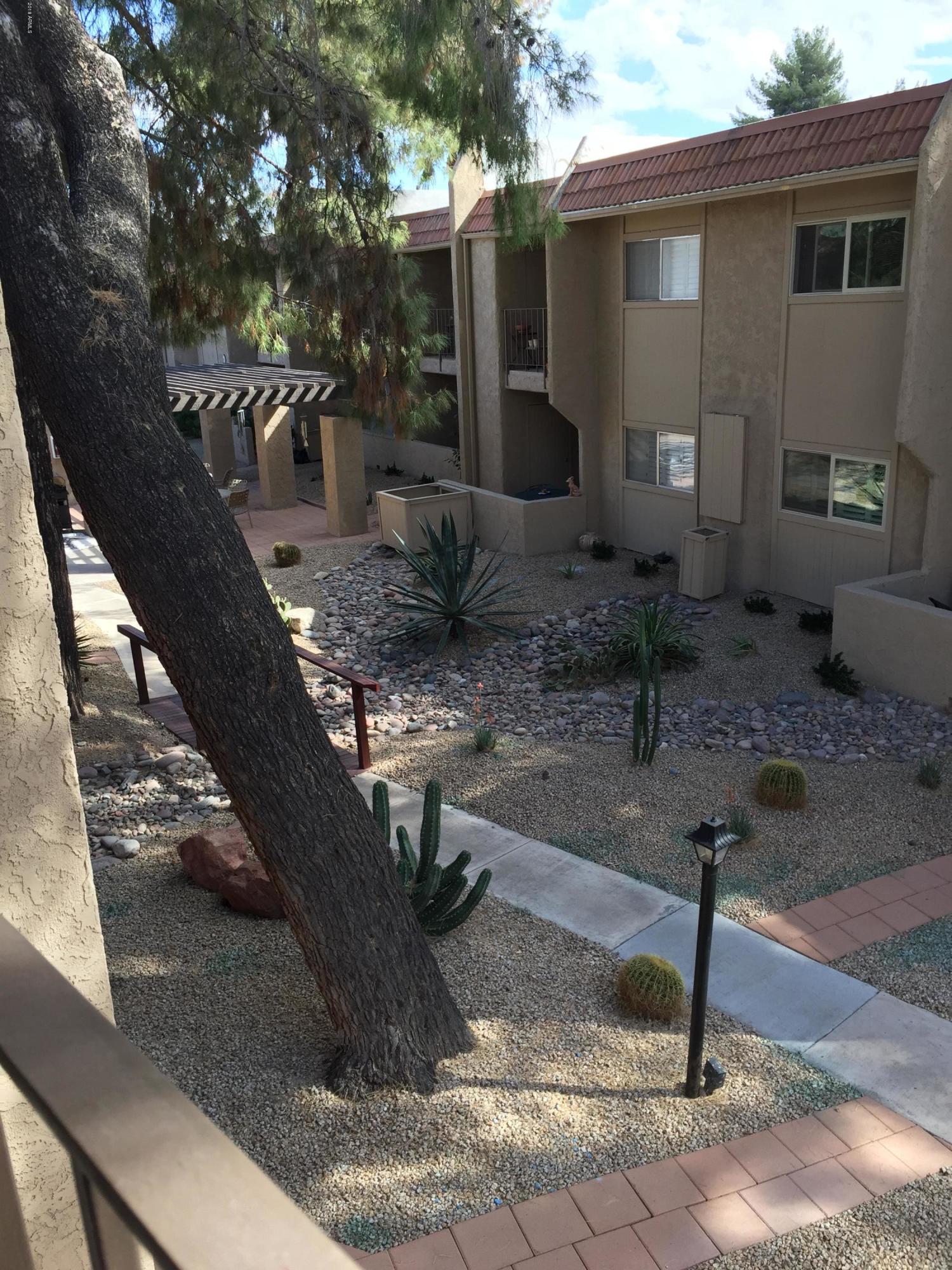 7436 East Chaparral Road, Unit 264B Scottsdale, AZ 85250 - Photo 22 of 27 a front view of a house with fountain