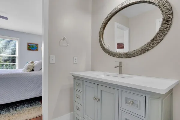 a bathroom with a sink and a mirror