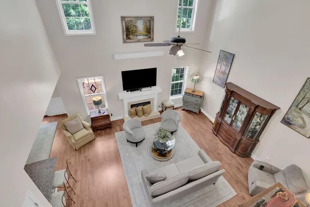 a living room with furniture fireplace and a flat screen tv
