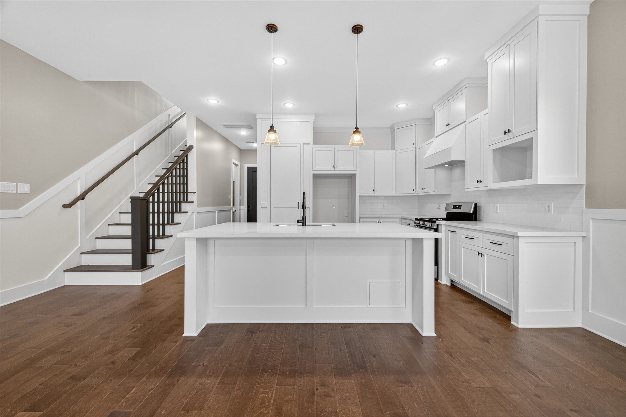 7325 Market Street Houston, TX 77020 - Photo 12 of 47 a view of kitchen with cabinets and wooden floor