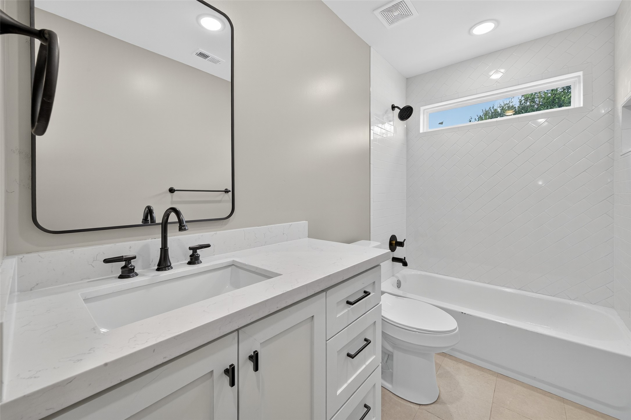 7325 Market Street Houston, TX 77020 - Photo 23 of 47 a bathroom with a sink a toilet a mirror and shower