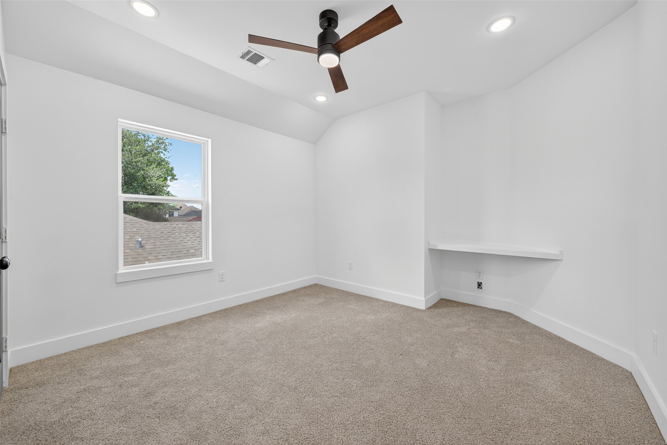 7325 Market Street Houston, TX 77020 - Photo 24 of 47 an empty room with a window and a ceiling fan