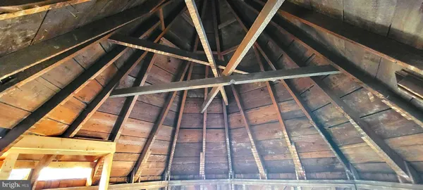 a view of wooden floor with some windows